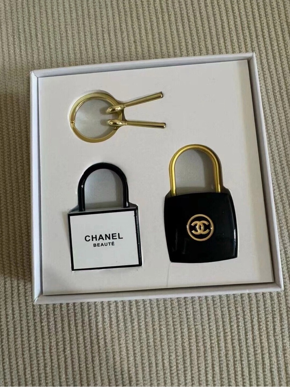 CHANEL Black and Gold Padlock Charm